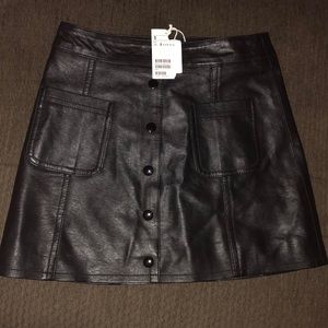 Black leather skirt. Never worn. With tags